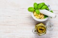 Pesto with Pestle and Mortar on Copy Space Area Royalty Free Stock Photo