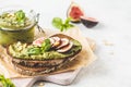 Pesto sauce sandwich with figs on rye bread Royalty Free Stock Photo