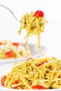 Pesto spaghetti with cherry tomato.