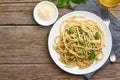 Pesto spaghetti pasta with basil, garlic, pine nuts, olive oil. Copy space. Rustic table Royalty Free Stock Photo