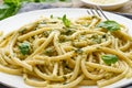 Pesto spaghetti pasta with basil, garlic, pine nuts, olive oil. Rustic table, macro Royalty Free Stock Photo