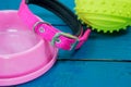 Pet accessories about collars, bowls of pink and rubber ball