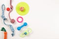 Pet accessories. Colorful cotton rope and rubber toys for cat puppy dog on white background. Top view, copy space Royalty Free Stock Photo