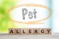 Pet allergy sign on a wooden desk Royalty Free Stock Photo