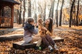 Pet care advice for autumn. Happy family mother and teen boy son walking and having fun with cocker spaniel puppy Royalty Free Stock Photo