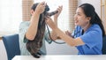 Pet care concept, Female veterinary use stethoscope to check breath of little kitten in vet clinic Royalty Free Stock Photo