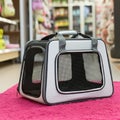 A pet carrier featuring a rectangular shape with gray and black fabric, reinforced with Royalty Free Stock Photo