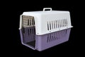 Pet carrier purple and white for traveling with a pet on isolated black Royalty Free Stock Photo