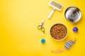 Pet, cat, food and accessories of cat life flat lay, with space for design, on yellow background Royalty Free Stock Photo