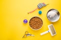 Pet, cat, food and accessories of cat life flat lay, with space for design, on yellow background Royalty Free Stock Photo