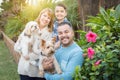 Pet Dogs with Mixed Race Family Portrait Outdoors Royalty Free Stock Photo