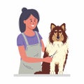 A young woman cuts a dog\'s fur