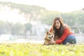 Pet lover concept. Young female and dog summer concept. The girl plays with the Shiba Inu dog in the backyard. asian women order