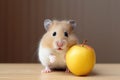 Pet nutrition: hamster relishing apple snack