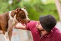 Pet owner receiving a kiss lick from his pet dog, loving affectionate bond Royalty Free Stock Photo