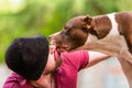 Pet owner receiving a kiss lick from his pet dog, loving affectionate bond Royalty Free Stock Photo