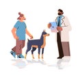 pet owner visiting veterinarian doctor checking up dog health medicine animal health care examination in veterinary