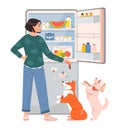 Pet owner. The woman opened the fridge with food and feeds the pets. Hungry woman checking refrigerator with food.