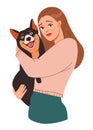 Pet owner. A young woman hugs a dog.