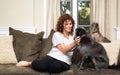 Pet Sitter on Couch Petting Dogs Royalty Free Stock Photo