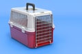 Pet travel plastic cage on blue backdrop, 3D rendering Royalty Free Stock Photo