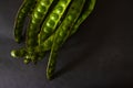 Petai, Twisted cluster bean, Stink bean, Bitter Bean, Parkia speciosa seeds, isolated on black background. Royalty Free Stock Photo