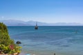 PETALIDI, GREECE - AUGUST 13, 2017: Tourists enjoying sea journey on vintage sail ships in Petalidi village, Greece