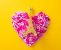Petals in heart shape and golden Eiffel tower statue