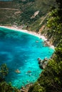 Petani beach on hot sunny summer day. View to Petani bay with transparent and crystal clear blue azure mediterranean sea Royalty Free Stock Photo