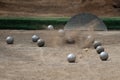 Petanque ball boules bawls on a dust floor