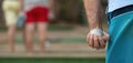 Petanque ball in hand of man Royalty Free Stock Photo