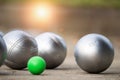 Petanque balls in the playing field with shady as a backdrop. Royalty Free Stock Photo