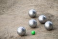 Petanque balls in the playing field with shady as a backdrop. Royalty Free Stock Photo