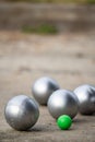 Petanque balls in the playing field with shady as a backdrop. Royalty Free Stock Photo