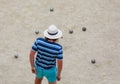 petanque player with white hat in the bowling alley Royalty Free Stock Photo