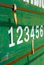 Petanque scoreboard number on green rusty metal texture plate