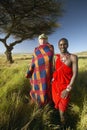 Peter Bender in Senior Elder robe and Masai warrior standing near Acacia Tree in the Lewa Conservancy of Kenya Africa