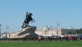 Peter The Great sculpture Horseman and a group of tourists in the summer