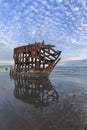 Refelction of shipwreck and sky in Oregon.