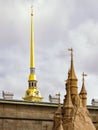 Peter and Paul fortress, the spire of Peter and Paul cathedral and the fragment of a sandy sculpture. Royalty Free Stock Photo