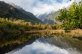 Peter`s Pool, Franz Josef National Park, New Zealand. Mountain and nature landscape reflected in calm lake Royalty Free Stock Photo