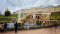 PETERGOF, SAINT PETERSBURG, RUSSIA - SEPTEMBER 18, 2016: Tourist admiring the Samson Fountain, the Grand Cascade and the Peterhof
