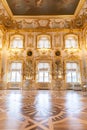 Peterhof palace, Saint Petersburg, Russia - February, 2020: Ballroom golden rococo interior. Summer imperial residence. Amazing