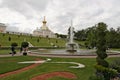 Peterhof, Russia, July 2019. A fountain in the form of a bowl and a view of the surrounding park.