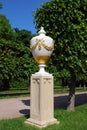 Attractions of the Peterhof Museum-reserve. Sculpture `Vase` on the alley in the Park.