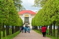 Peterhof, Russia - June 03. 2017. tourists around Pavilion Hermitage and Foliage Alley Lower Park