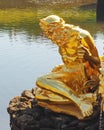 Peterhof, RUSSIA Ã¢â¬â May 1, 2019: Close up view of a part of Grand cascade ensemble. Golden sculpture of a myth hero.
