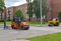 PETERHOF, RUSSIA.Road skating rinks work at asphalt laying