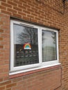 Crochet rainbow in a house window placed there in support of National Health Workers during the Covid Pandemic