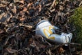 Empty disgarded MacDonalds Drink cup with platic lid thrown away as litter Royalty Free Stock Photo